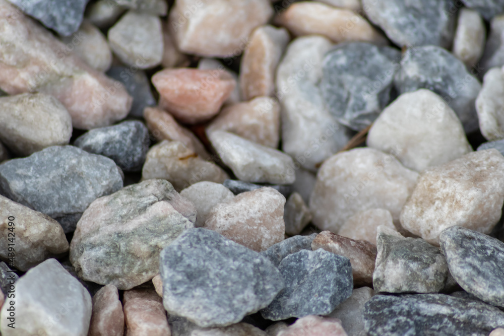 Raw rocks and minerals as natural stones background with crushed and rough material at a rough coast or rocky beach show nuggets and sandstones in harmonic pastel colors as natural mineral background Raw rocks and minerals as natural stones background with crushed and rough material at a rough coast or rocky beach show nuggets and sandstones in harmonic pastel colors as natural mineral background