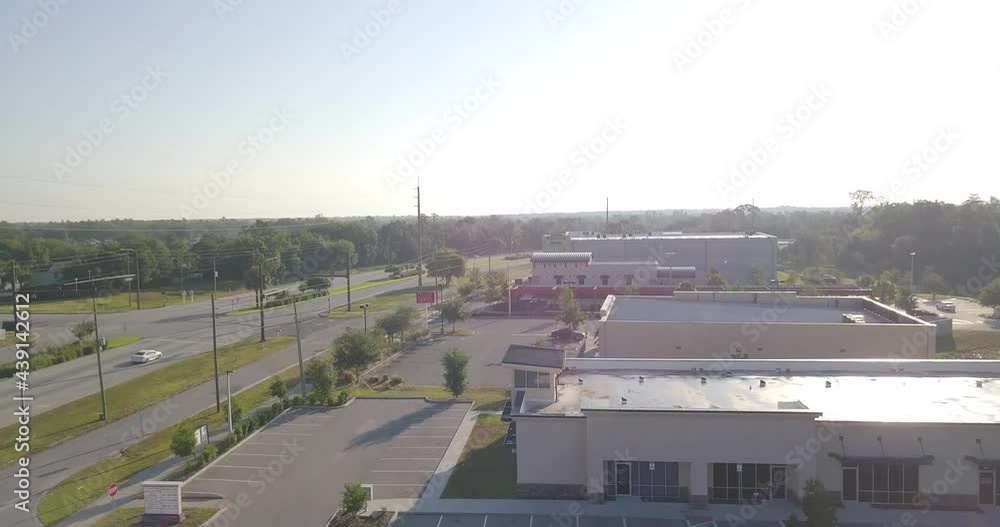 Drone Taking Off over Strip Mall in Morning Drone Taking Off over Strip Mall in Morning