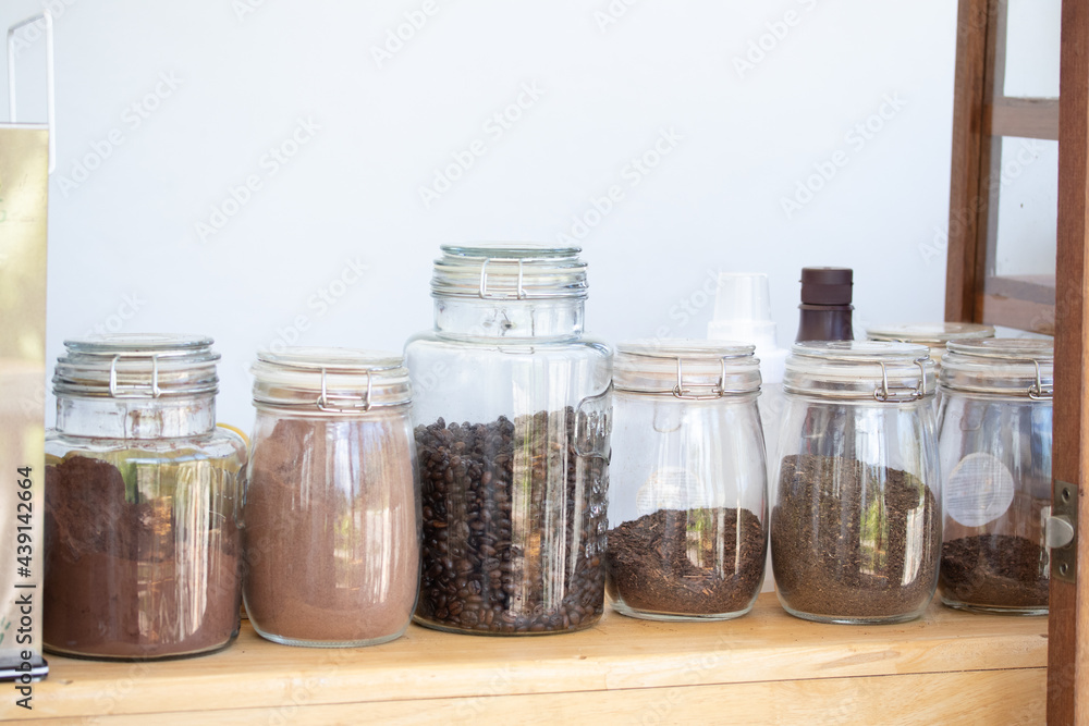 Glass jar for tea, coffee, cocoa powder in a coffee shop Glass jar for tea, coffee, cocoa powder in a coffee shop