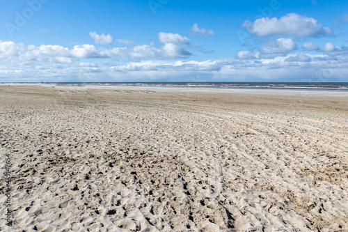 Dune beach, the sea with calm waves in the background, sunny day with a blue sky with abundant white clouds in Hargen aan Zee, North Holland, Netherlands