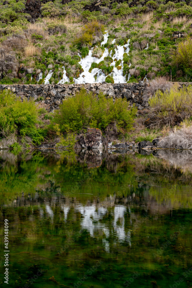 Thousand Springs waterfall reflection in a small pond Idaho Thousand Springs waterfall reflection in a small pond Idaho