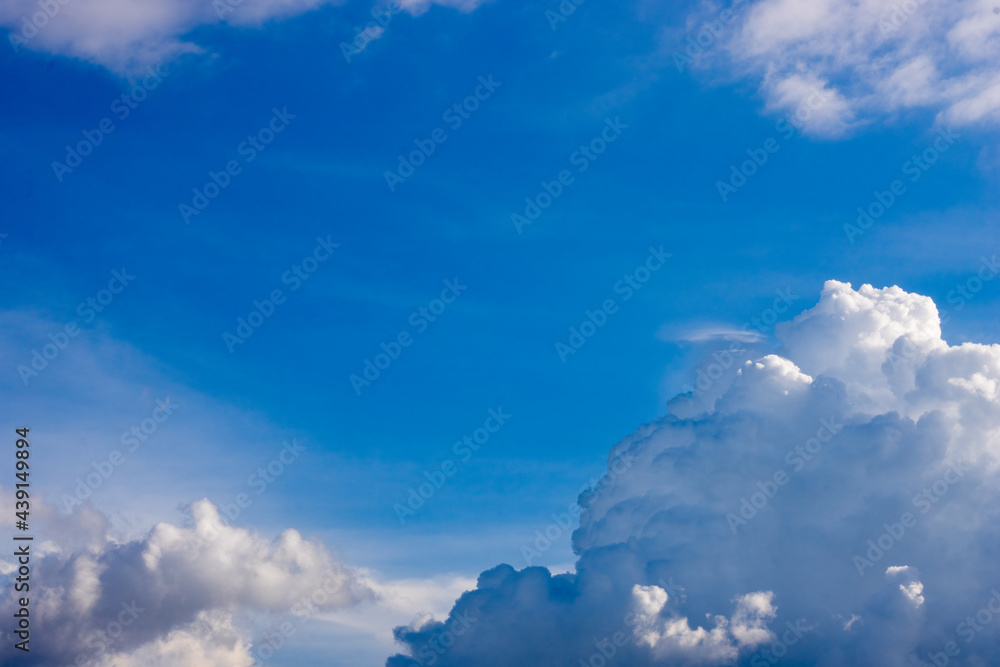 White clouds on the sunny blue sky background White clouds on the sunny blue sky background