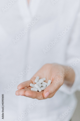 coated tablets pour woman hand medicine stress