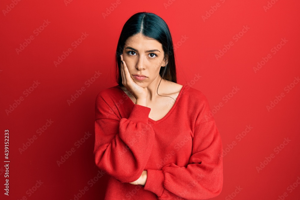 Young hispanic woman wearing casual clothes thinking looking tired and bored with depression problems with crossed arms. Young hispanic woman wearing casual clothes thinking looking tired and bored with depression problems with crossed arms.
