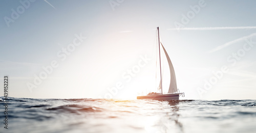 Sailing yacht on the ocean photo