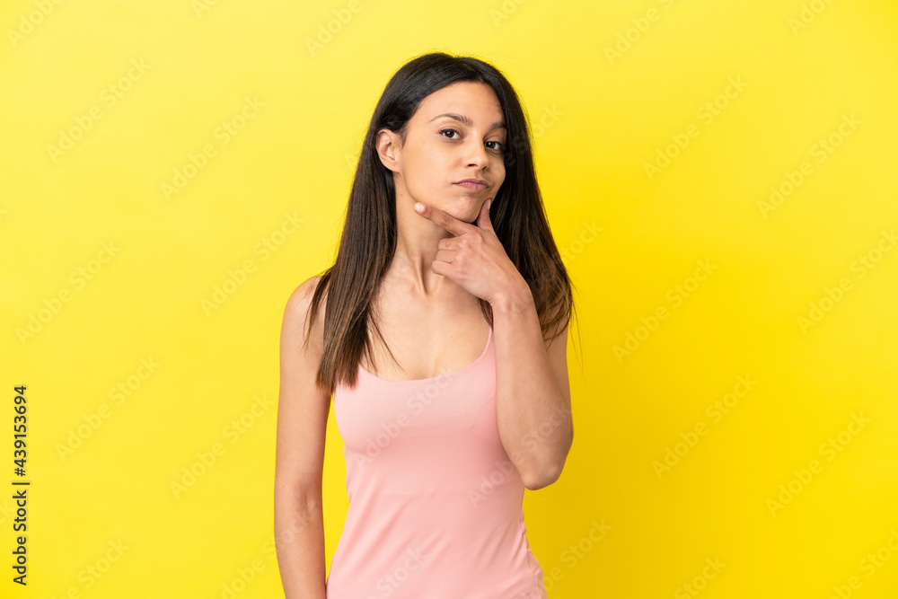 Young caucasian woman isolated on yellow background thinking Young caucasian woman isolated on yellow background thinking