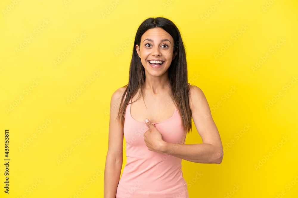 Young caucasian woman isolated on yellow background with surprise facial expression Young caucasian woman isolated on yellow background with surprise facial expression