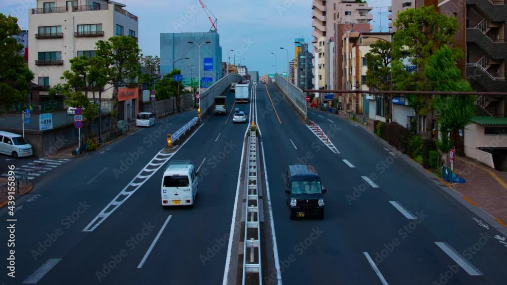 A timelapse of traffic jam at the avenue daytime in the downtown wide shot panning A timelapse of traffic jam at the avenue daytime in the downtown wide shot panning
