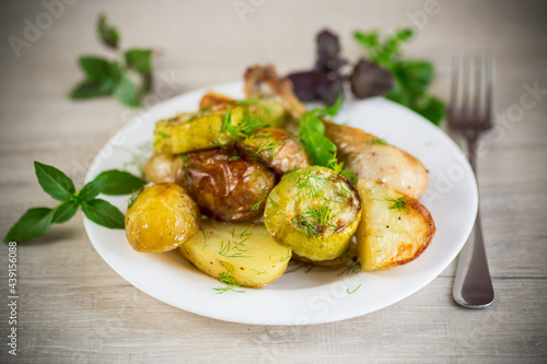 Early baked potatoes with zucchini and chicken