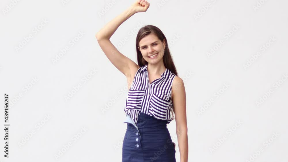 Excited happy woman winner raised both hands in delight. Excited happy woman winner raised both hands in delight.