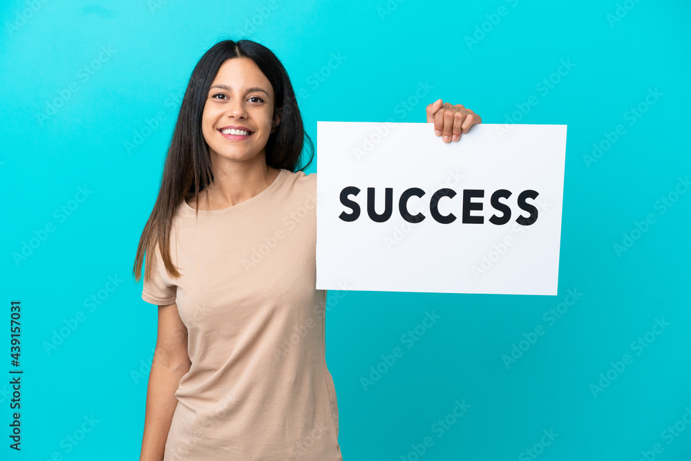 Young woman over isolated background holding a placard with text SUCCESS with happy expression Young woman over isolated background holding a placard with text SUCCESS with happy expression