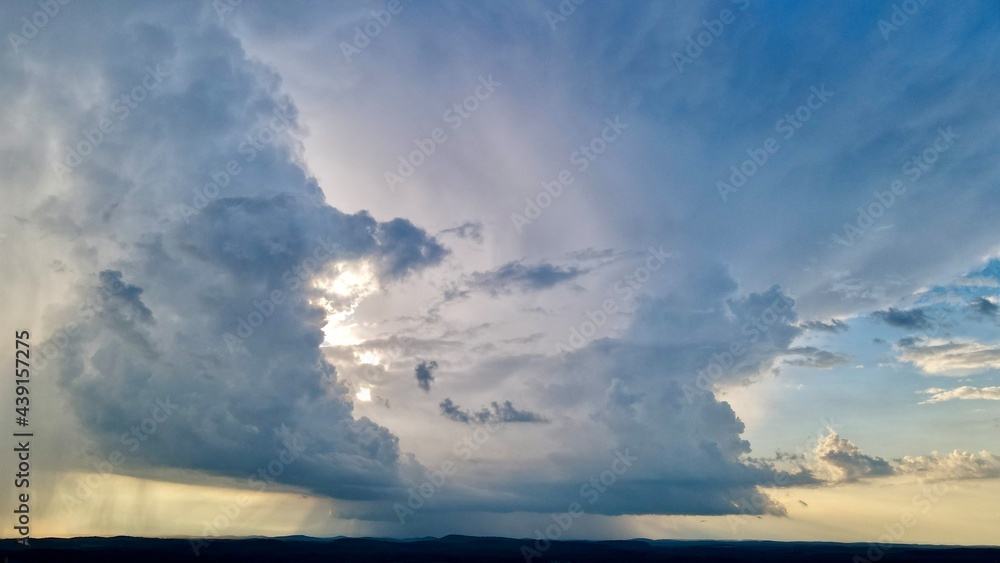 Naklejka premium Larger severe thunderstorm clouds moving over the landscape