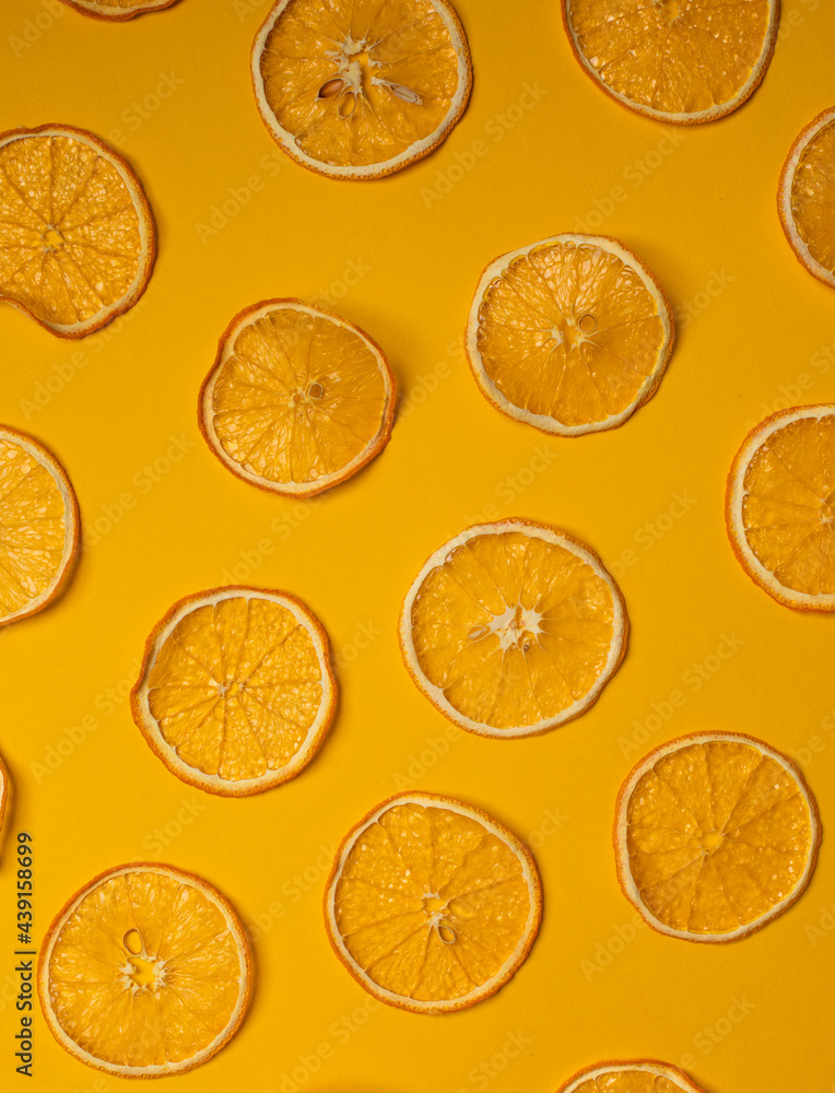 Top view of pattern of dried orange slices lying