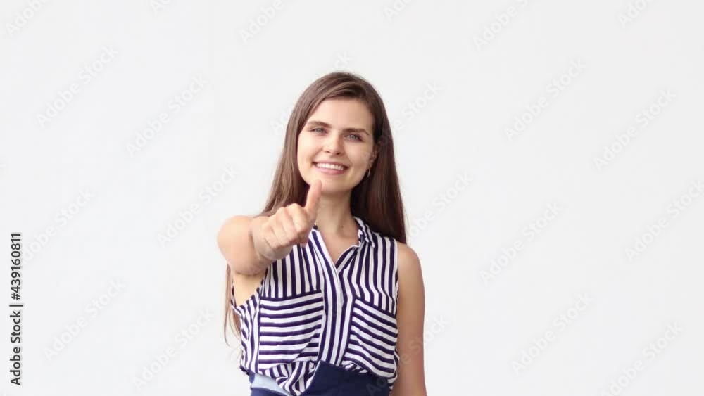 Closeup portrait happy proud confident young professional businesswoman leader winner employee looking at the camera showing thumbs up hand sign gesture on white background. Closeup portrait happy proud confident young professional businesswoman leader winner employee looking at the camera showing thumbs up hand sign gesture on white background.