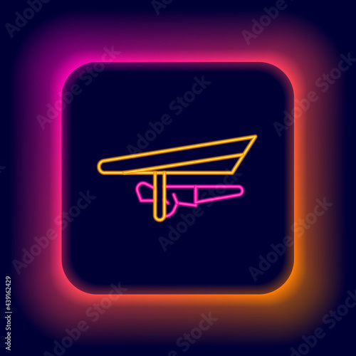 Glowing neon line Hang glider icon isolated on black background. Extreme sport. Colorful outline concept. Vector