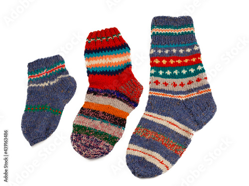 Knitted socks isolated on white background. Warm multi-colored wool sock. Set