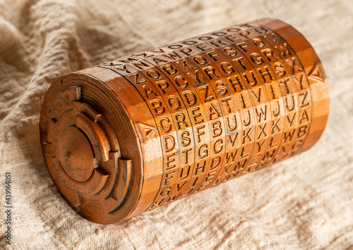 Copper cryptex invented by Leonardo da Vinci from the book da vinci code. Word creativity as password set by letters rings. Cryptographic equipment printed on a 3D printer