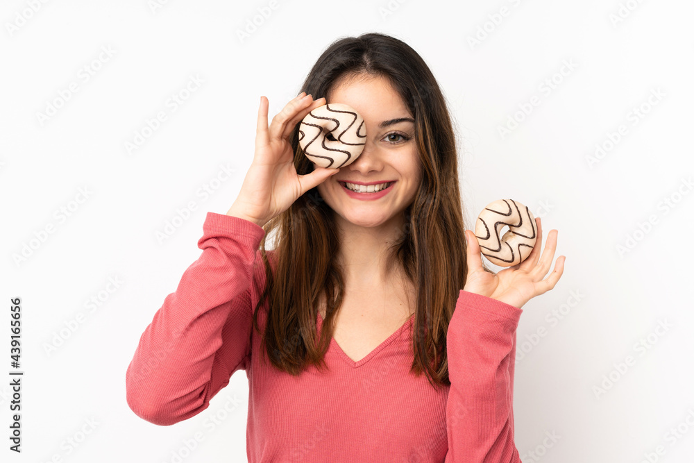 Young caucasian woman isolated on pink background holding a donut and happy Young caucasian woman isolated on pink background holding a donut and happy