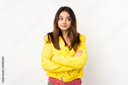 Young caucasian woman isolated on white background making doubts gesture while lifting the shoulders