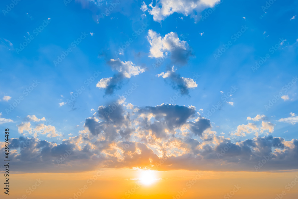 dramatic sunset on blue cloudy sky, beautiful natural evening background dramatic sunset on blue cloudy sky, beautiful natural evening background