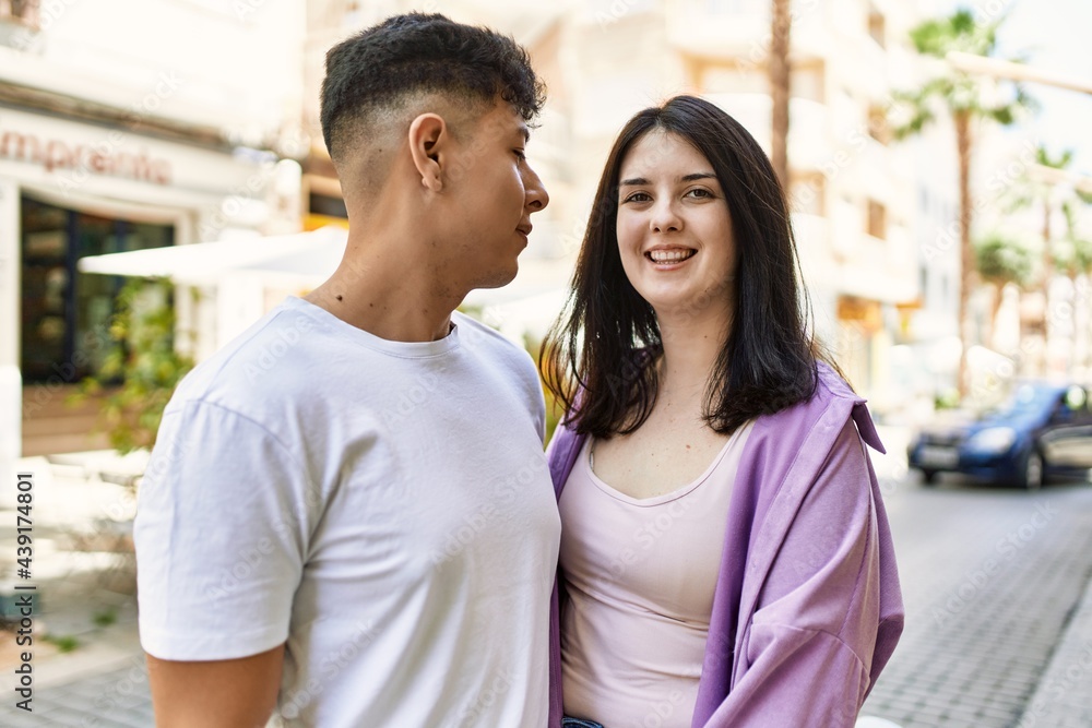 Fototapeta premium Young hispanic couple of boyfriend and girlfriend together outdoors on a sunny day