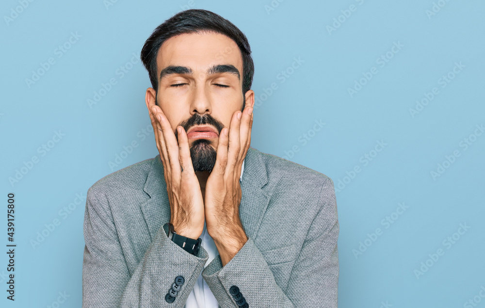 Young hispanic man wearing business clothes tired hands covering face, depression and sadness, upset and irritated for problem Young hispanic man wearing business clothes tired hands covering face, depression and sadness, upset and irritated for problem