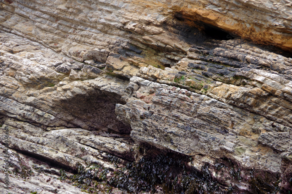 Earth formation with layers of rocks in an California ocean cliff Earth formation with layers of rocks in an California ocean cliff