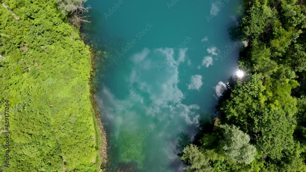 Aerial drone view of river source. Beautiful green river and forest in spring. Aerial drone view of river source. Beautiful green river and forest in spring.