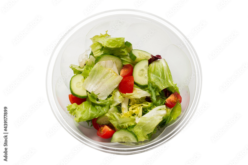 Salad with fresh vegetables isolated on a white background. Salad with fresh vegetables isolated on a white background.