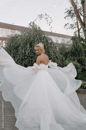 bride in white weddind dress whirls