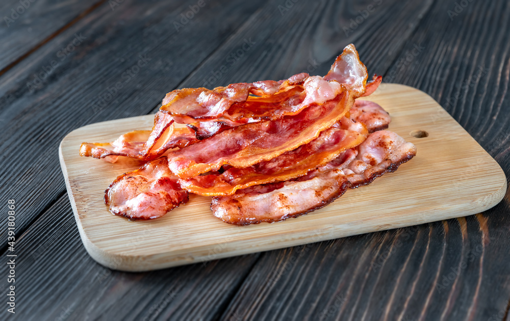 Fried bacon on the cutting board Fried bacon on the cutting board