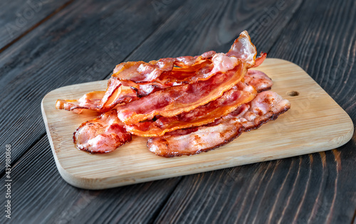Fried bacon on the cutting board