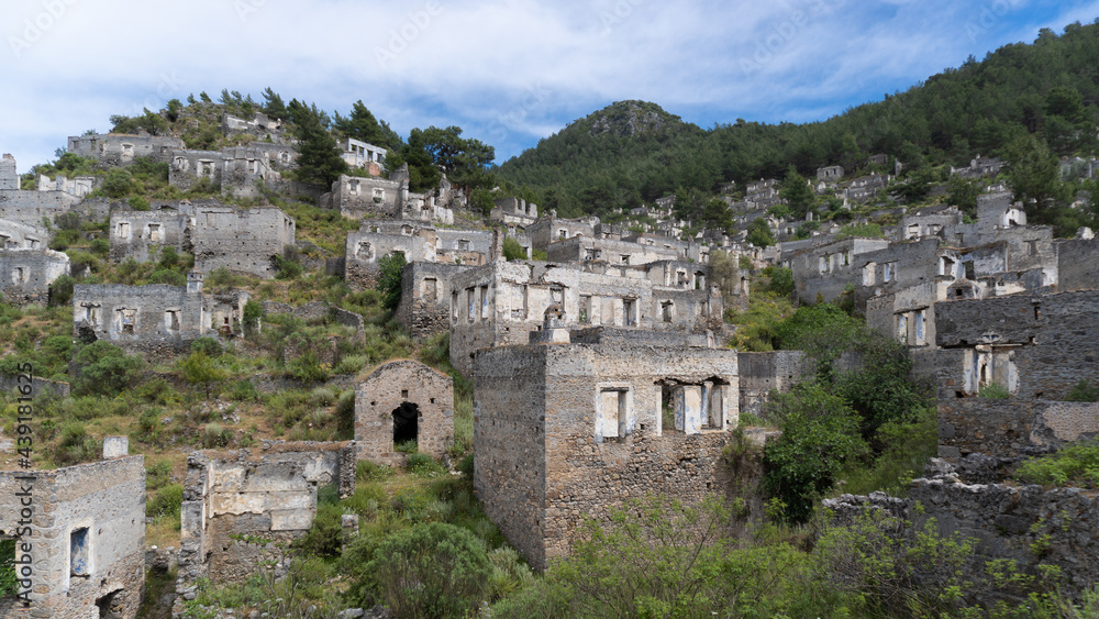 Ruins of ancient Lycian town Olympos in Turkey. Abandoned, old, dilapidated, stone houses ancient city in Turkey