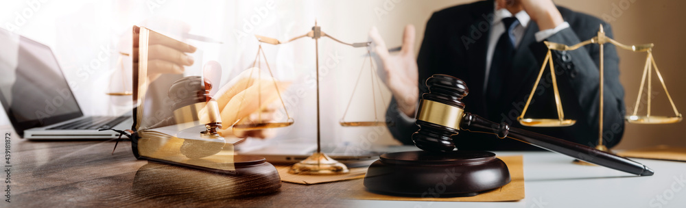 justice and law concept.Male judge in a courtroom on wooden table and Counselor or Male lawyer working in office. Legal law, advice and justice concept. justice and law concept.Male judge in a courtroom on wooden table and Counselor or Male lawyer working in office. Legal law, advice and justice concept.