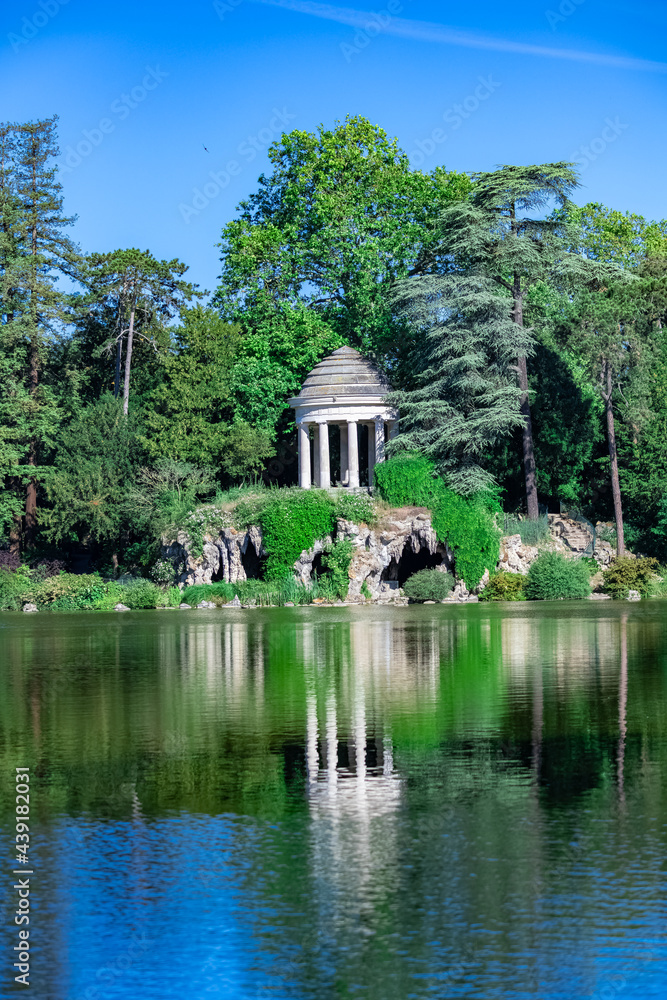 Vincennes, the temple of love and artificial grotto on the Daumesnil lake, in the public park 
