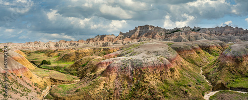 Title: Yellow mounds and colorful red rocks and dramatic mountains in the Badlands National Park - South Dakota photo