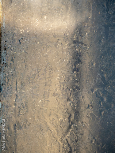 close-up of the frozen glass window. Selective focus, texture