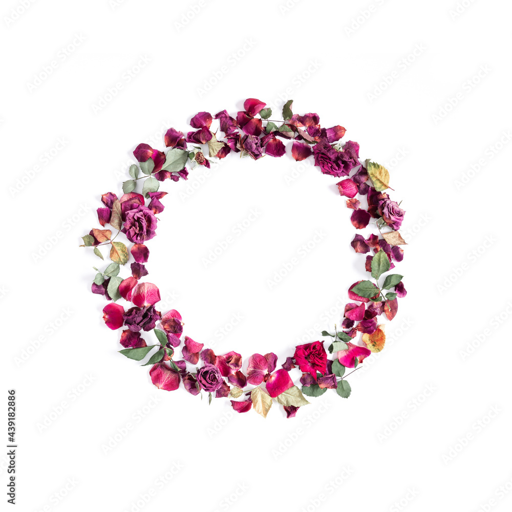 Wreath is made of dried rose flowers. Dried roses on white background. Flat lay, top view, copy space Wreath is made of dried rose flowers. Dried roses on white background. Flat lay, top view, copy space