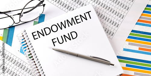 Notebook with text ENDOWMENT FUND . Diagram and white background