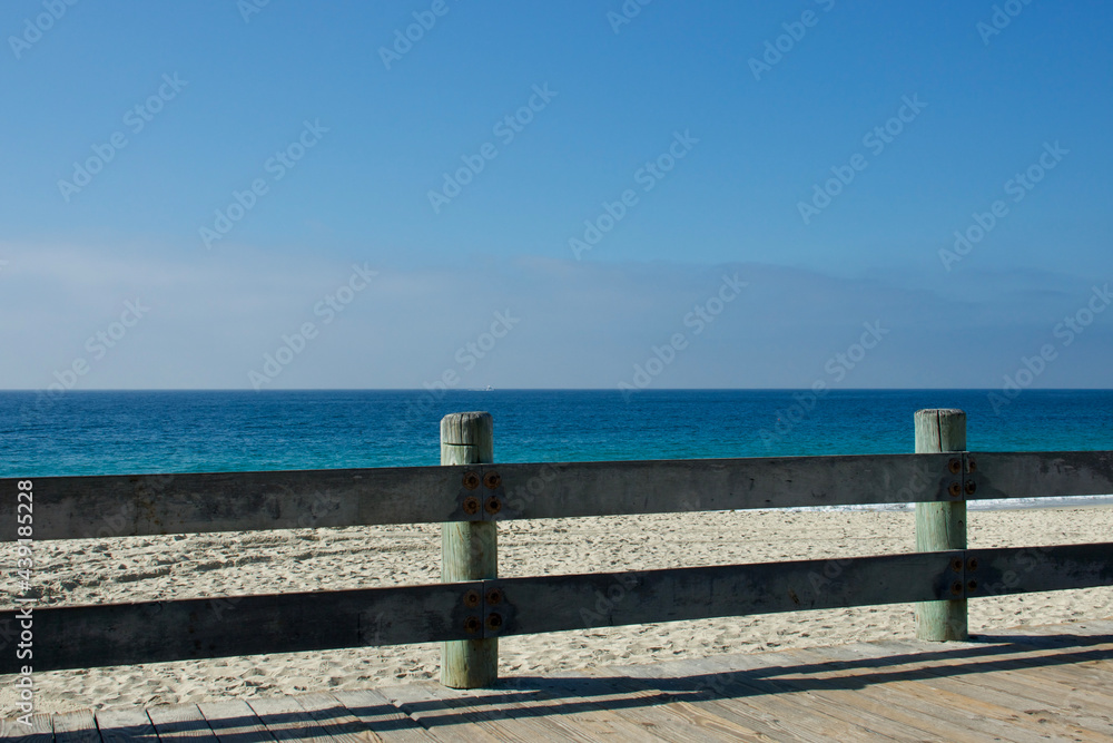 Laguna Beach boardwalk with deep horizon and low clouds Laguna Beach boardwalk with deep horizon and low clouds