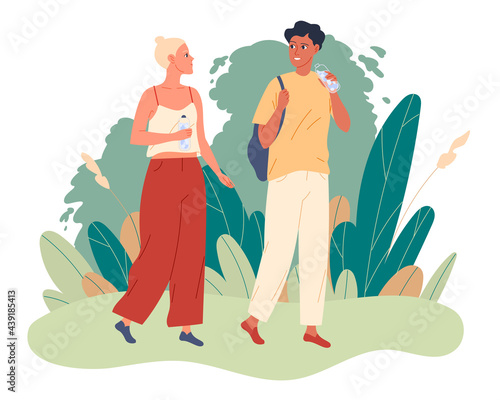 Couple walks in the park and they drink water