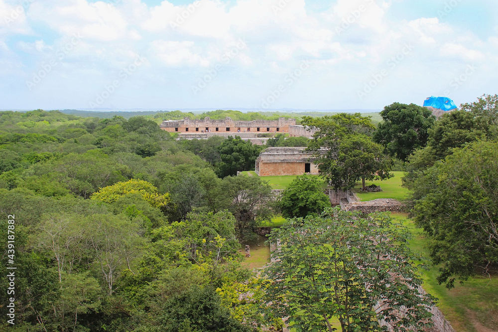 Uxmal, aerial view on Nunnery and the Pyramid of the Magician, view from the top of Great Pyramid situated on the territory of Uxmal archeological and historical site, Yucatan, Mexico. Soft focus