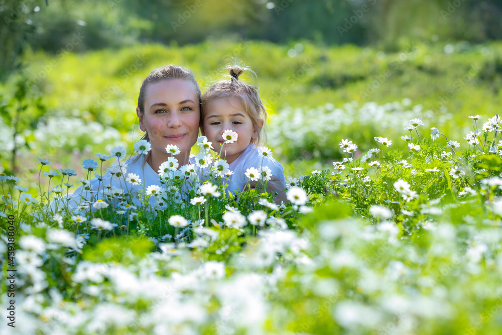 Mother With Baby in Flower Field Mother With Baby in Flower Field