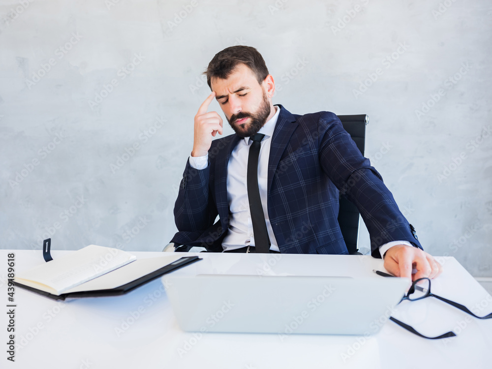 Young man having stressful time working on laptop and thinks concentratedly. Young man having stressful time working on laptop and thinks concentratedly.