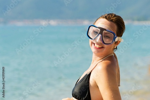 young woman with scuba diving mask
