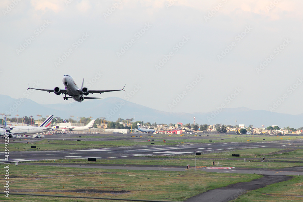 Plane taking off from the runway, flying through the clouds, increasing its height
Plane taking off from the runway, flying through the clouds, increasing its height