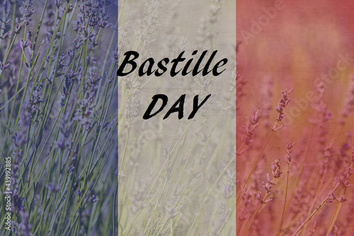 Bastille Day. National Day of France,written in French and a flag of France, against a white  background with copy space  for text .  happy 14th of July. photo