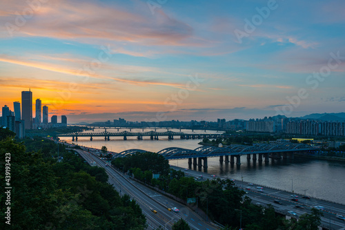 sunset view of 63 building and nodeul island and han river bridge traffic cars driving, seoul city attractions, south korea
