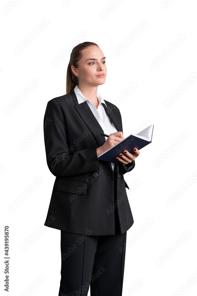 Attractive business woman in formal suit and shirt is holding a planner and pen, taking notes, looking forward and dreaming about future corporate career prospectives. Isolated over white background Attractive business woman in formal suit and shirt is holding a planner and pen, taking notes, looking forward and dreaming about future corporate career prospectives. Isolated over white background