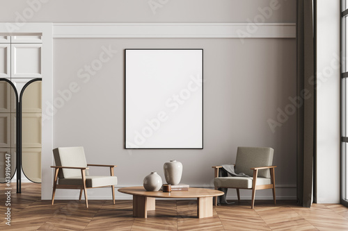 Framed mockup posters in apartment living room design interior  beige furniture on bright wall  wood floor  two armchairs. Concept of relax.